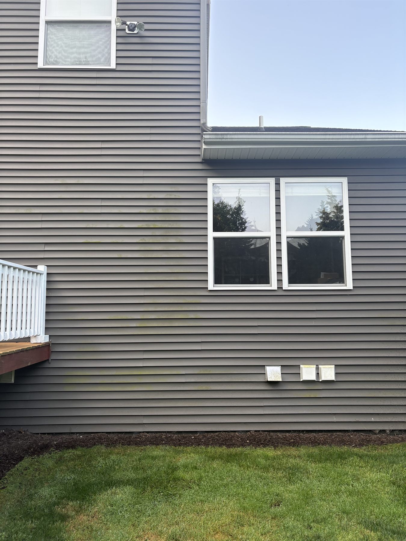 House siding before pressure washing